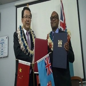 Fiji's health minister Mr Jone Usamate inks MOU with Chinese vice health minister Mr Sun Zhigan (Pc: www.fijitimes.com)